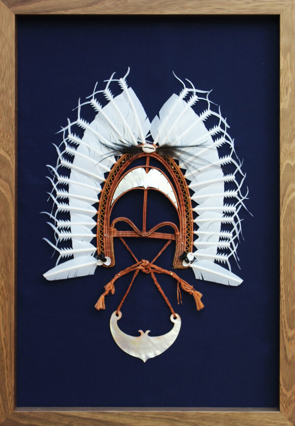Framed Dhoeri headdress with layered white feathers and mother-of-pearl crescent pendant