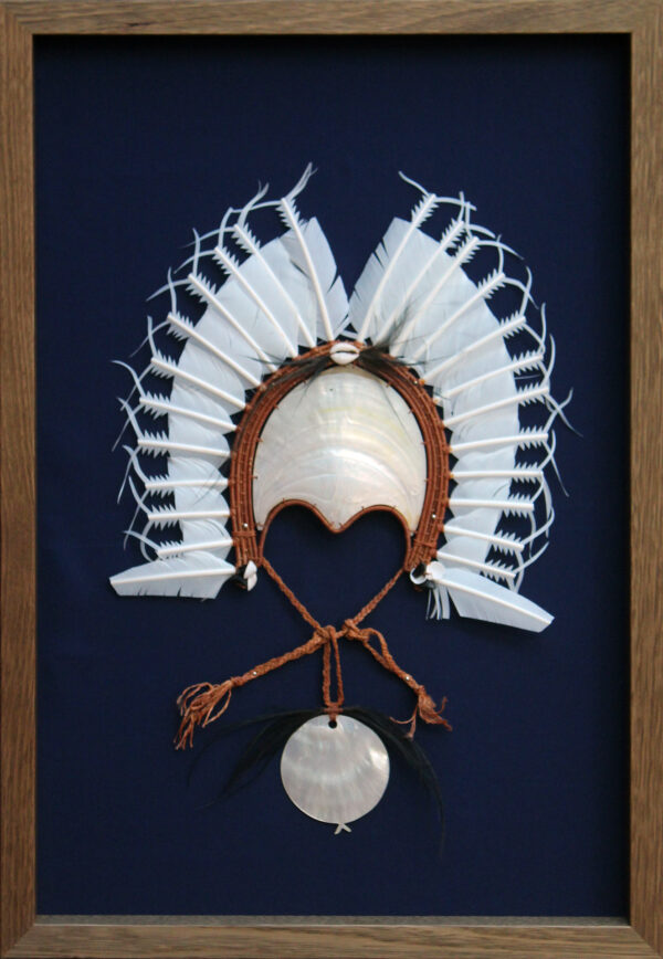 Framed Dhoeri headdress with full pearl shell centrepiece and circular shell pendant